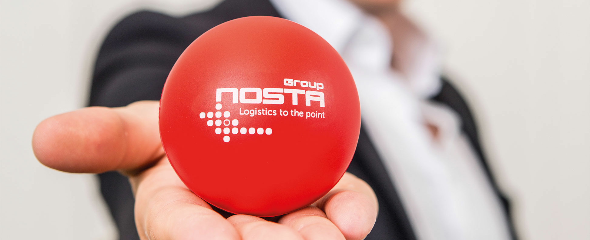 NOSTA Group Leitbild mit rotem NOSTA-Ball