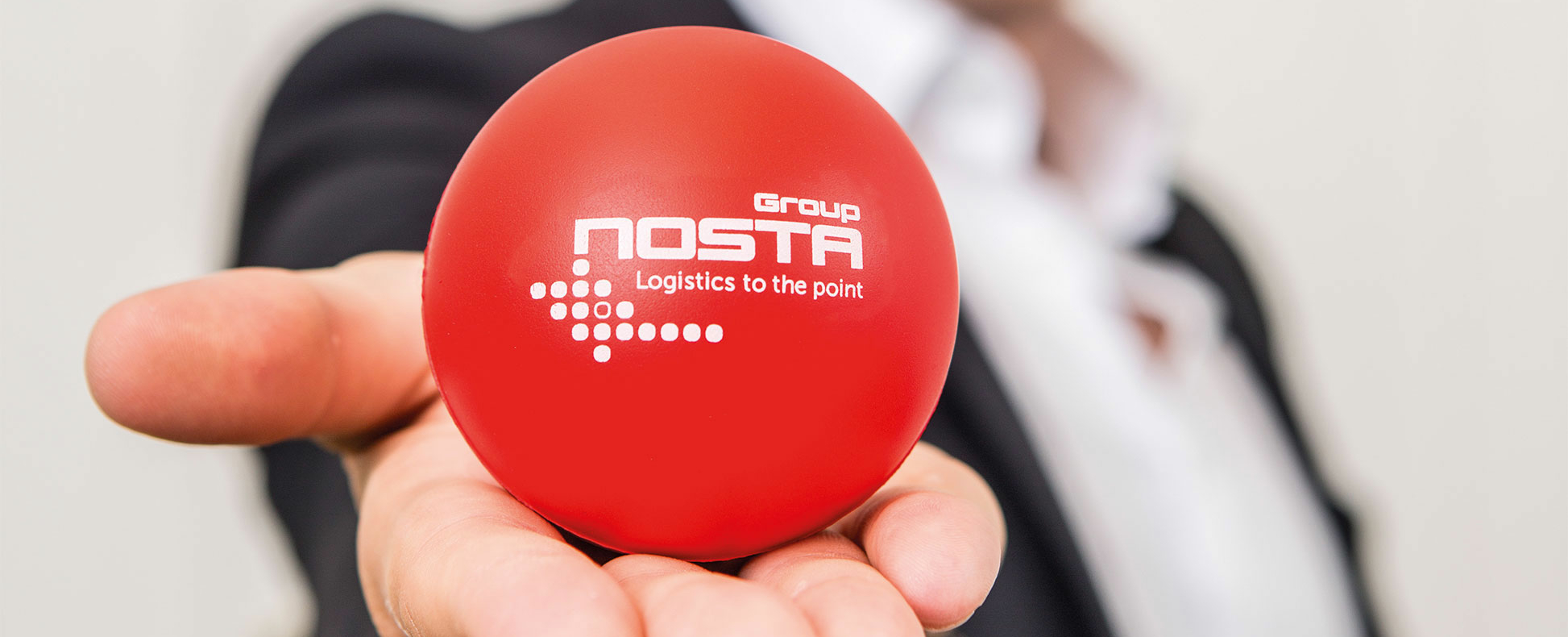 NOSTA Group mission statement with red NOSTA ball