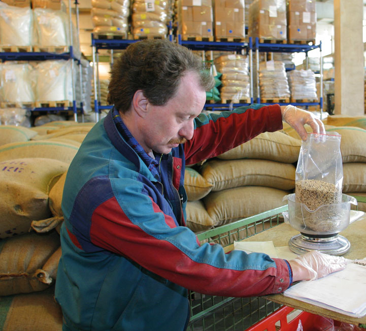 Employees weighing feed