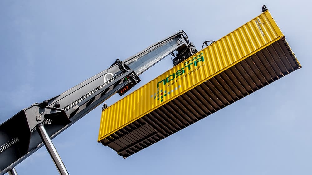 Reachstacker lifts containers into the air